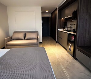Classic Apartment, City View | Desk, blackout curtains, iron/ironing board, free WiFi