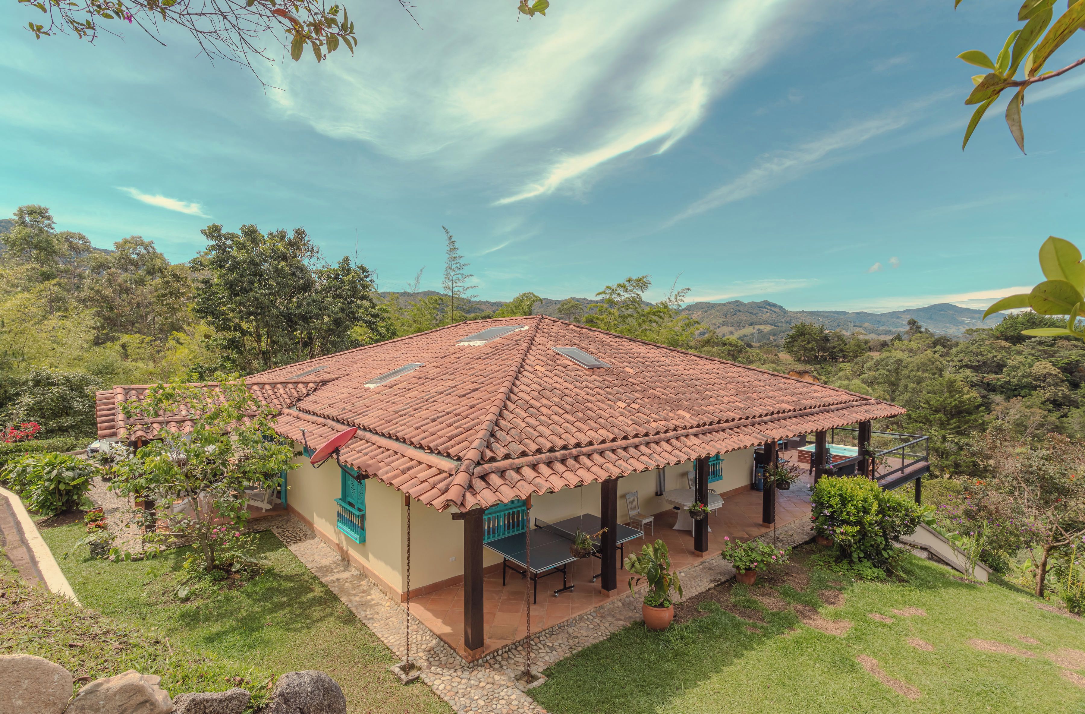 Tile-roofed hacienda among the mountains