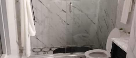 Shower, hair dryer, towels, soap