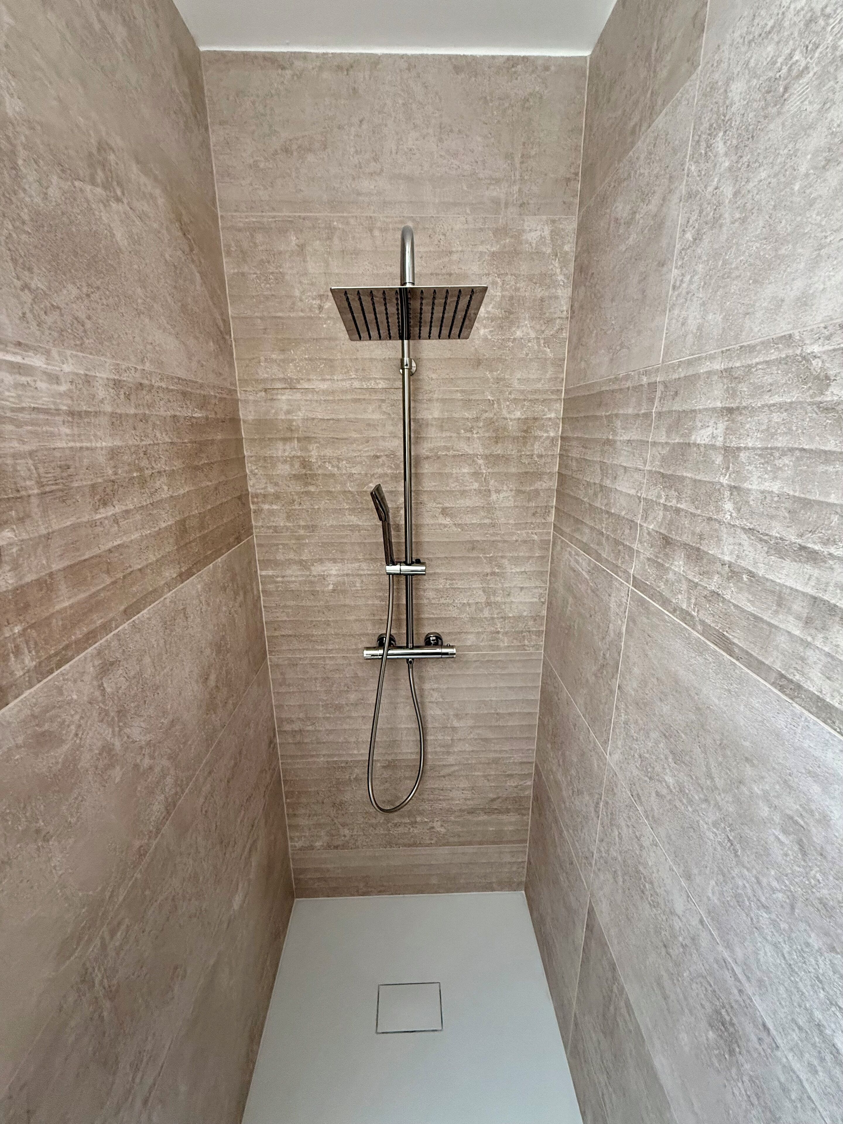 Shower, hair dryer, towels, toilet paper
