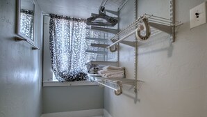 A laundry room with a window, a drying rack, and a towel rack. - Carriage House studio min to ECU (Ada)