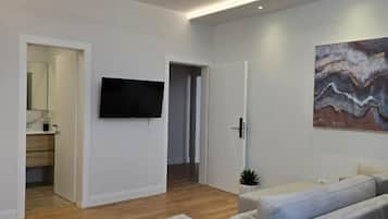 Standard Apartment | Living area | 40-inch Smart TV with cable channels