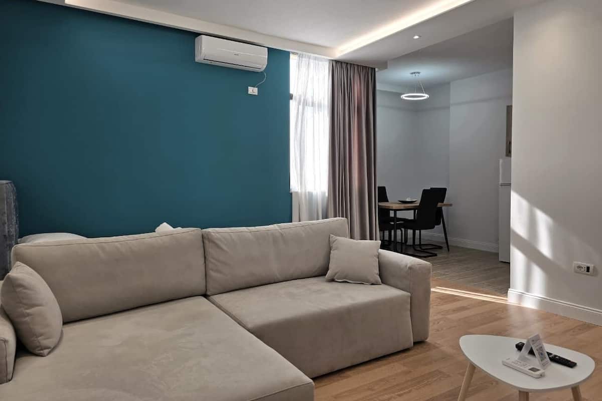 Standard Apartment | Living area | 40-inch Smart TV with cable channels