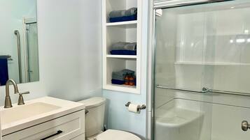 Shower, hair dryer, towels, soap