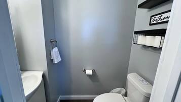 Half bathroom 1- Attached to the downstairs kitchen and living area for easy access between meals or during intermission duirng your family movie nights