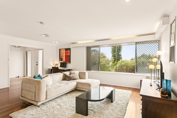 Flooded with natural light, this lounge room provides a smartTV & beautiful view
