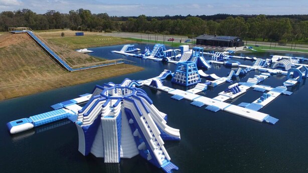 An aerial view of a water park with various water slides and structures. - Designed Stay-Convenient, Coastal, Comfortable (Karrinyup)