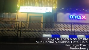 A building with a sign that reads "max" and a sign above the entrance that says "Sardar Vallabhai Patel Salai Heritage Town Puducherry". - Sun Shine Guest House (Puducherry)