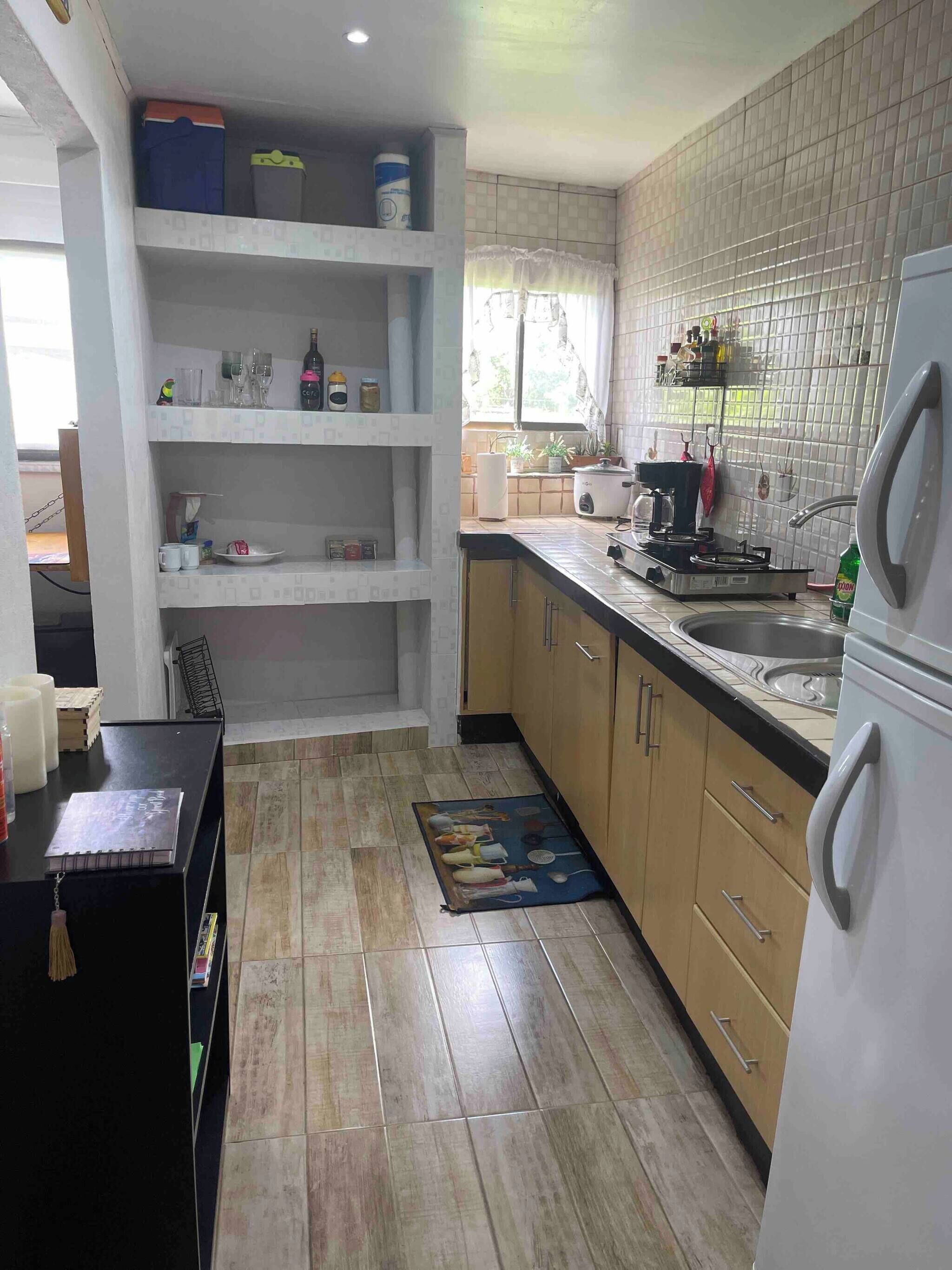 Fridge, microwave, stovetop, coffee/tea maker