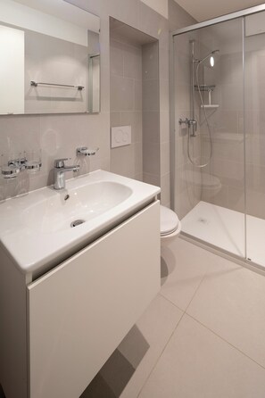 Shower, towels, soap, toilet paper