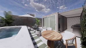 A modern outdoor patio with a hot tub, a wooden table, and chairs. - Luxurious Tanki Flip Townhouses with Rooftop & Pool Palm Beach Area (Noord)