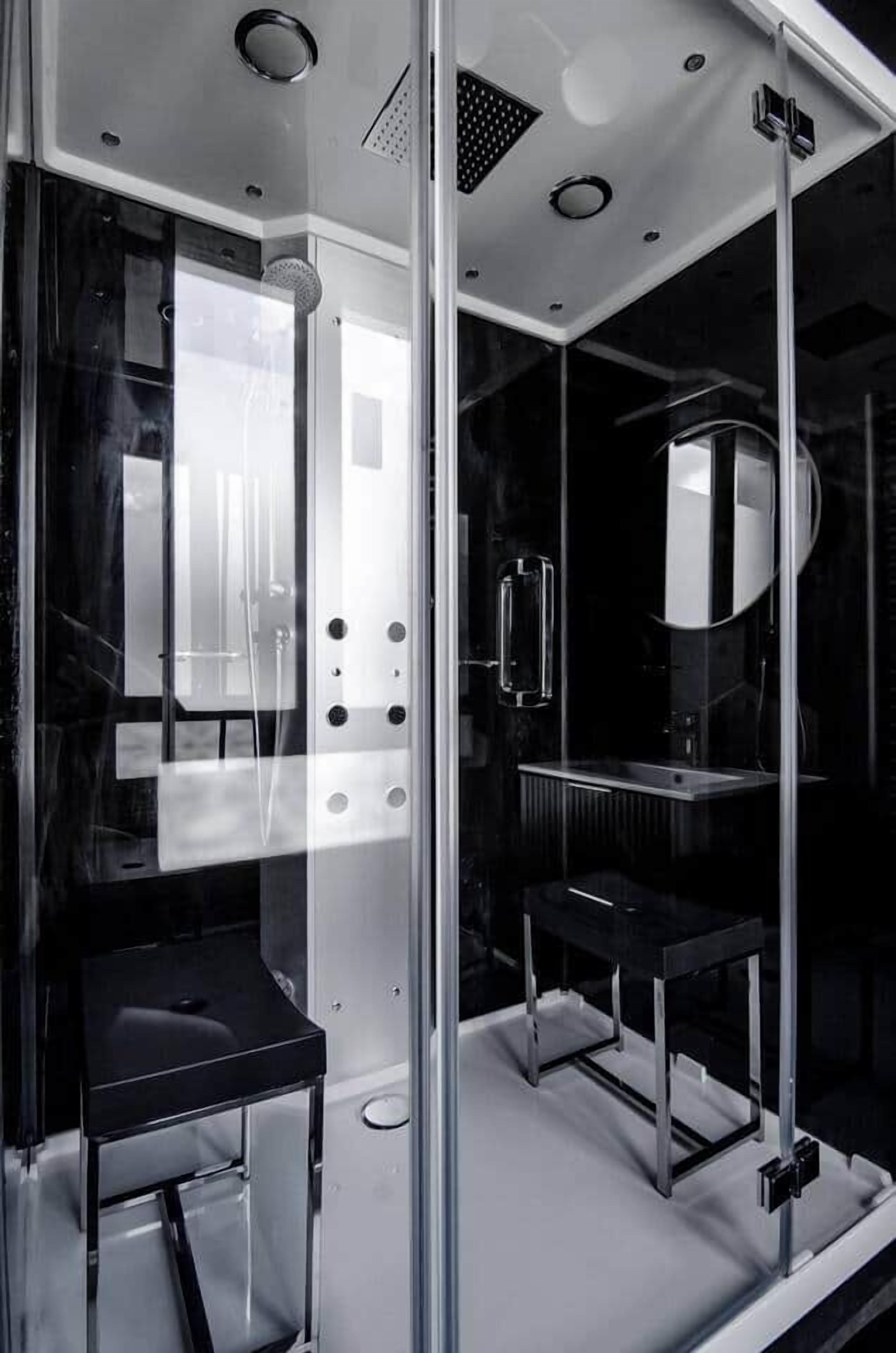 Un baño moderno con cabina de vidrio, lavabo y espejo.