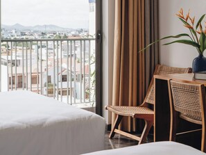 Premier Quadruple Room | Minibar, in-room safe, desk, laptop workspace