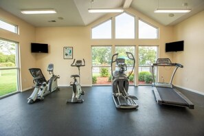 A gym with treadmills, elliptical machines, and stationary bikes. - Spacious 2BR Getaway at Palace View Heights with Full Resort Amenities (Branson)