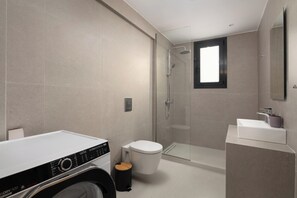 Shower, hair dryer, towels, toilet paper