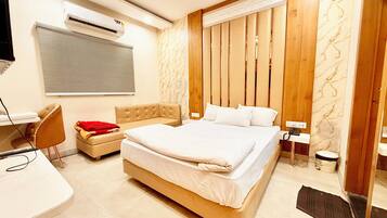 Premium bedding, desk, laptop workspace, soundproofing