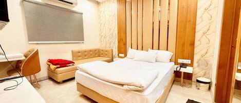 Premium bedding, desk, laptop workspace, soundproofing