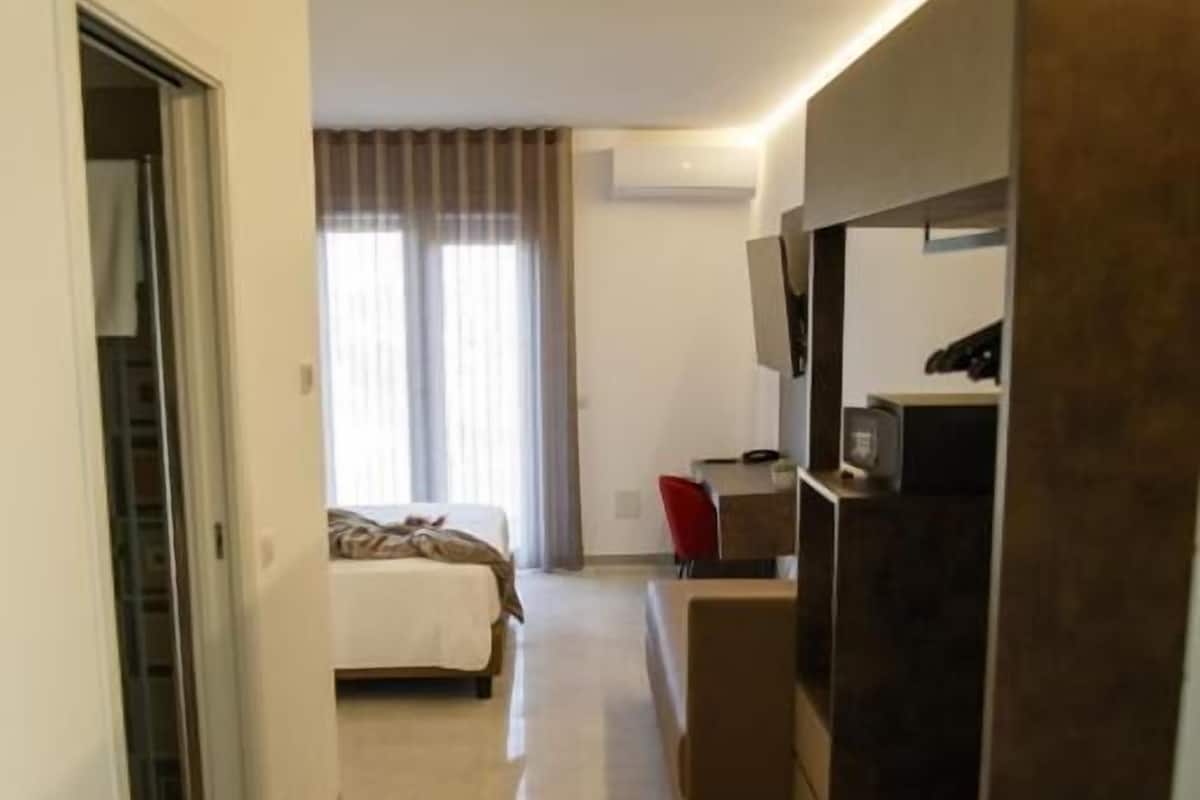 Junior Triple Room, Balcony | In-room safe, desk, free WiFi
