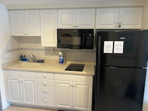 Fridge, microwave, stovetop, coffee/tea maker