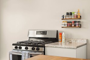 Fridge, microwave, cookware/dishes/utensils, dining tables