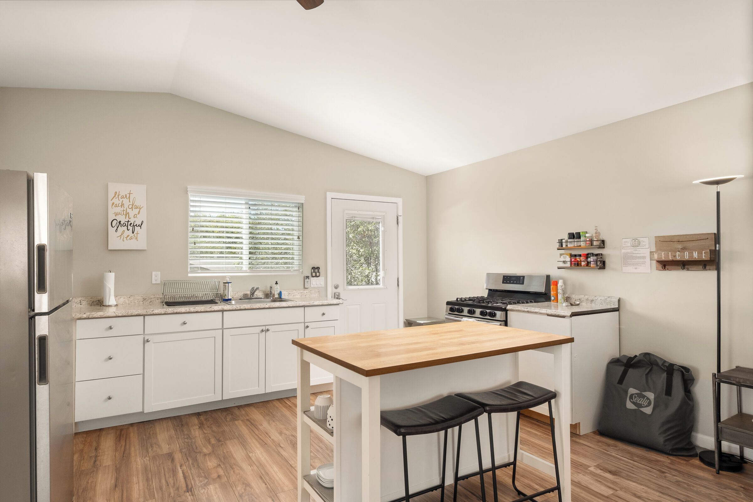 Fridge, microwave, cookware/dishes/utensils, dining tables