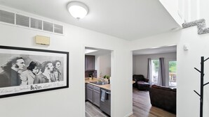 A modern interior with a kitchen, dining area, and a living room.