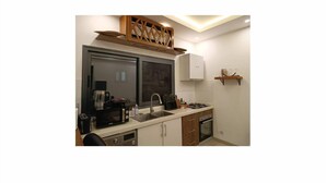 Private kitchen - Aviya - Furnished studio with bedroom and living room (Dakar)