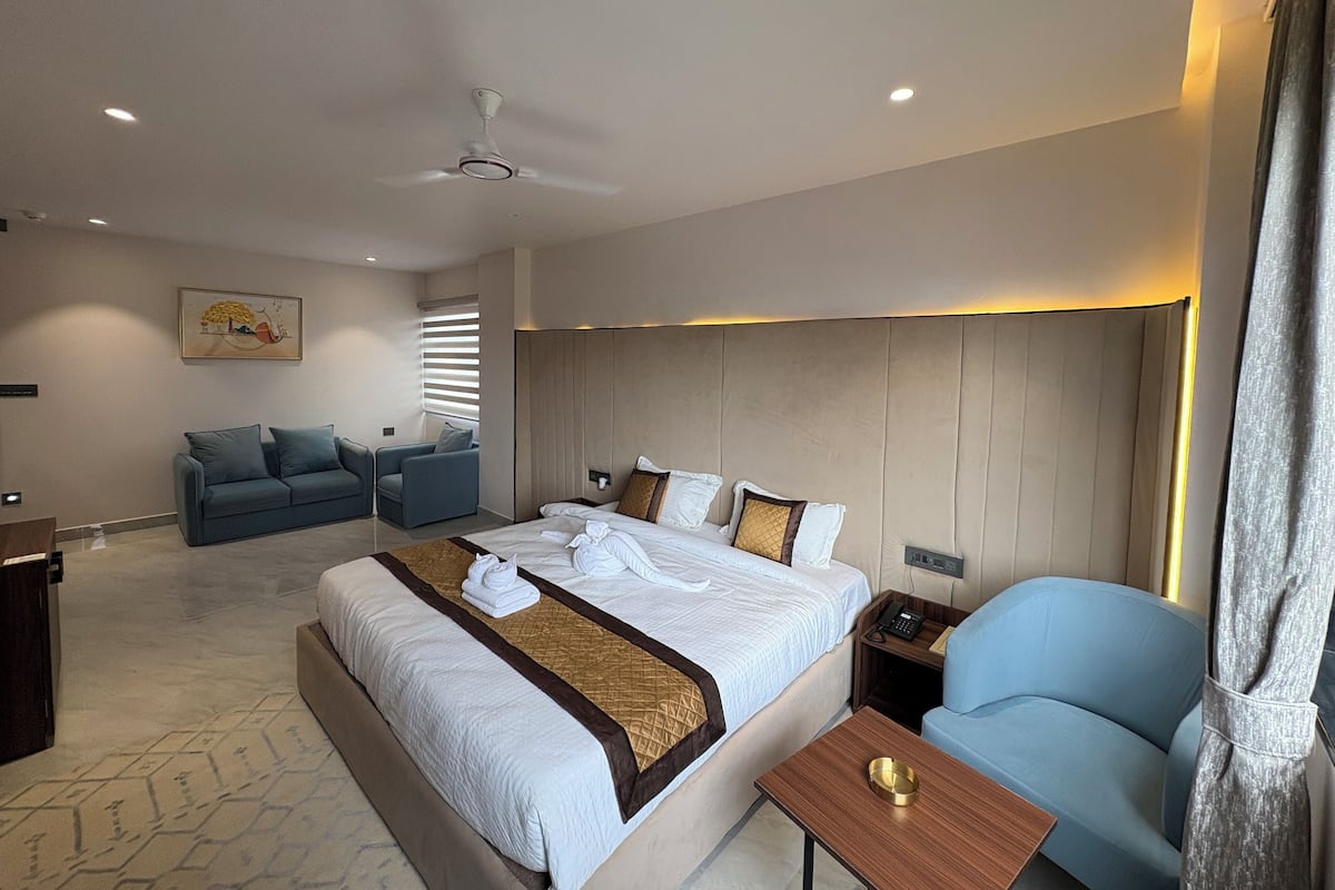 Luxury Suite, City View | Desk, laptop workspace, blackout curtains, iron/ironing board