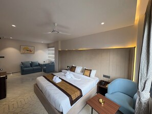 Luxury Suite, City View | Desk, laptop workspace, blackout drapes, iron/ironing board