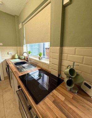 Fridge, microwave, oven, cookware/dishes/utensils