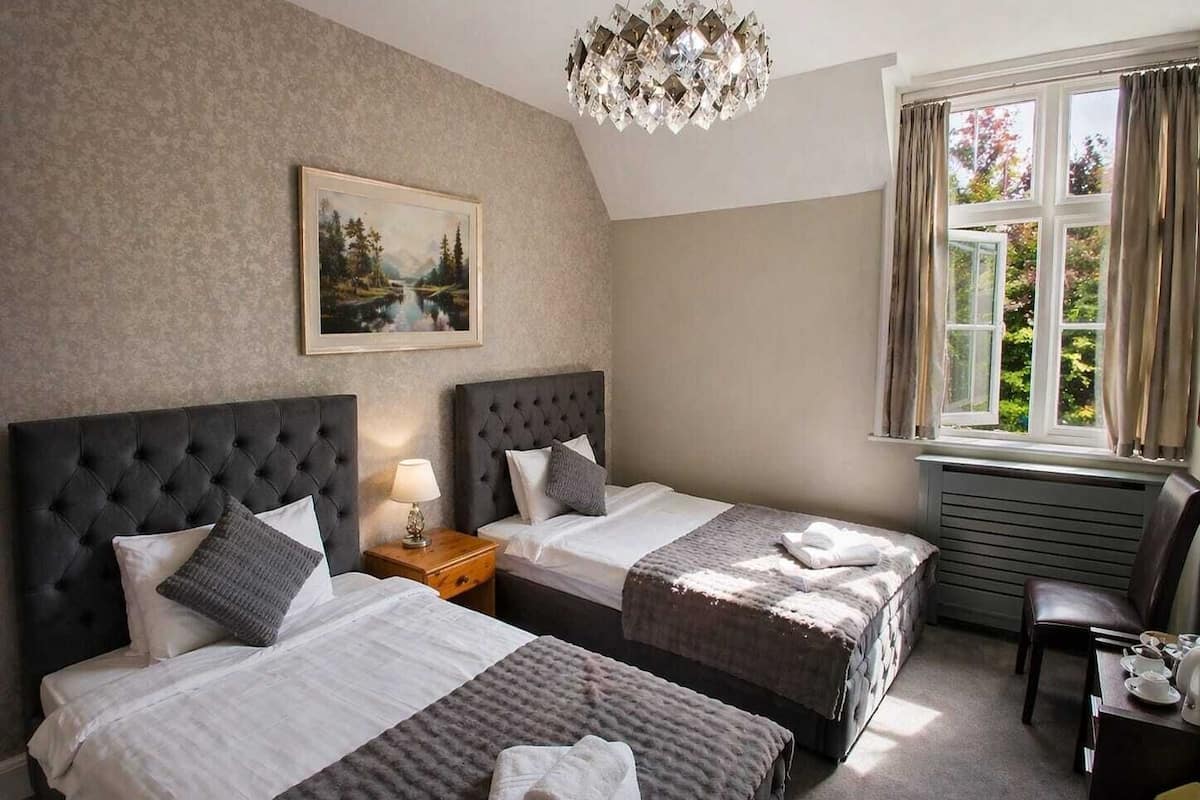 Comfort Twin Room, Garden View | Blackout drapes, iron/ironing board, free WiFi