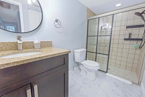 Shower, hair dryer, towels, shampoo