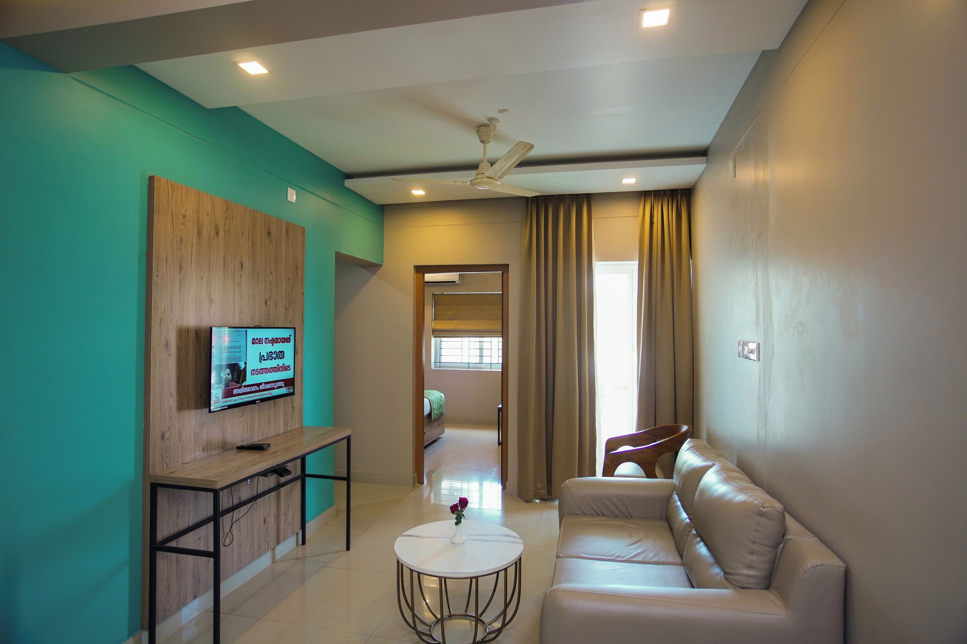 Deluxe Room, Balcony | Living area