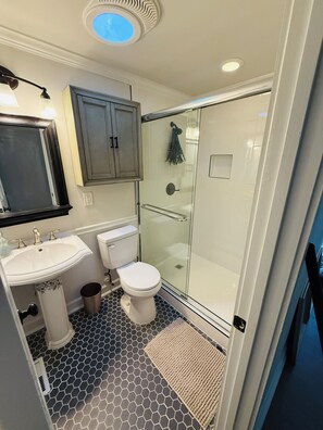 Shower, hair dryer, towels, soap