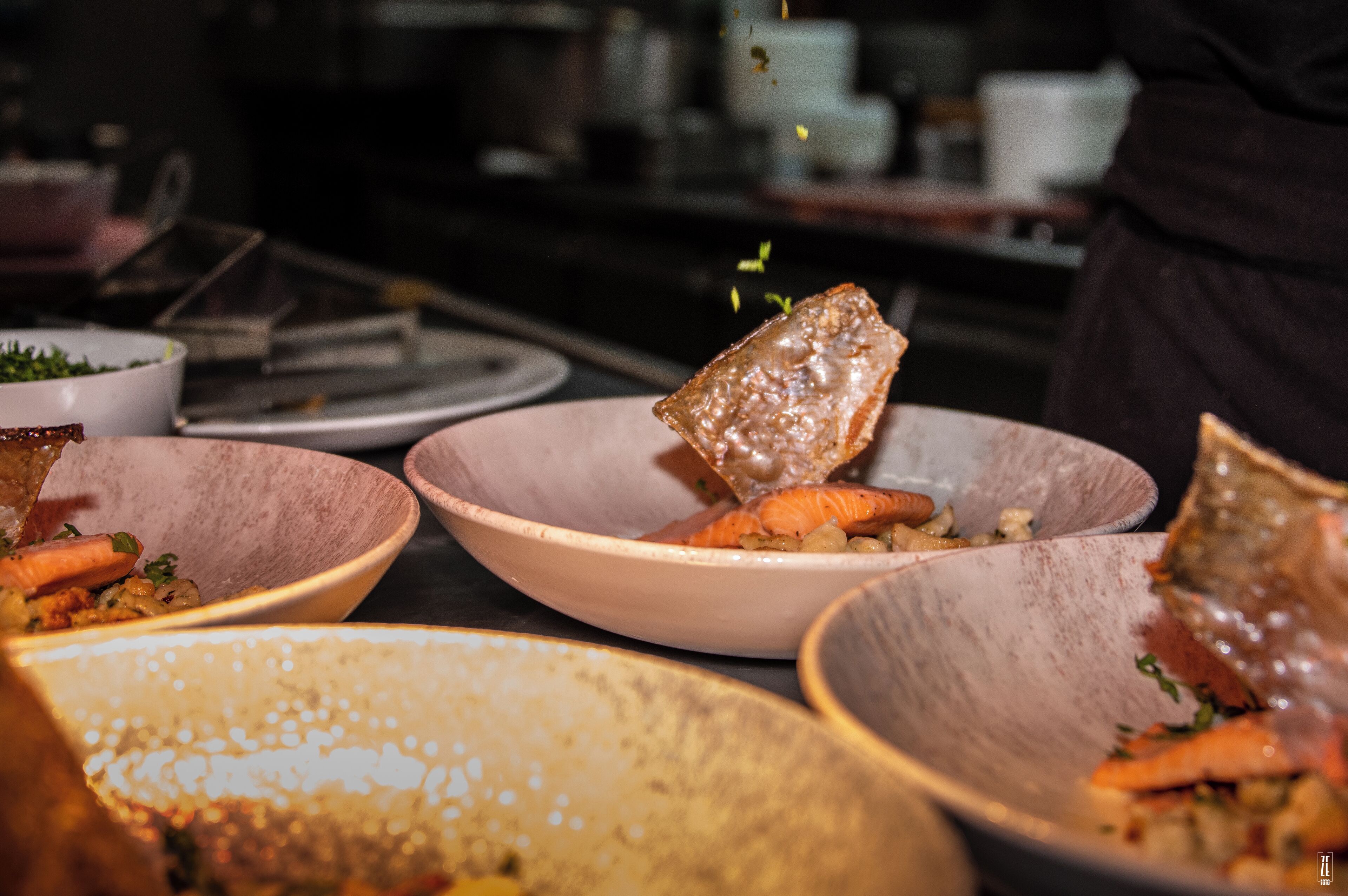 A variety of dishes in ceramic bowls, suggesting a dining setting.