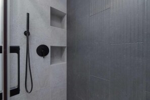 Shower, hair dryer, towels, shampoo