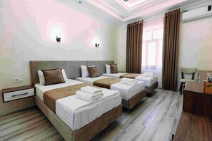 Deluxe Triple Room, City View | In-room safe, desk, laptop workspace, blackout drapes - Yurt (Samarkand)
