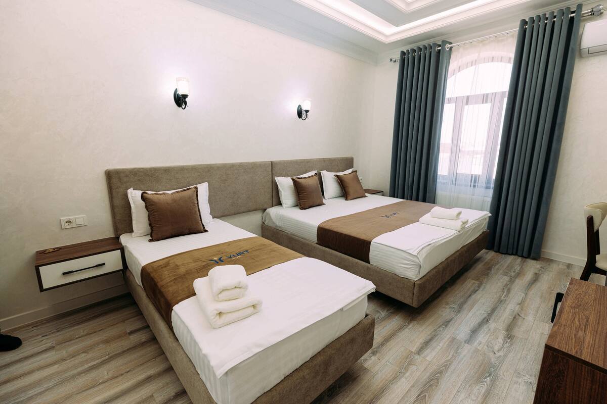 Deluxe Double or Twin Room, City View | In-room safe, desk, laptop workspace, blackout drapes