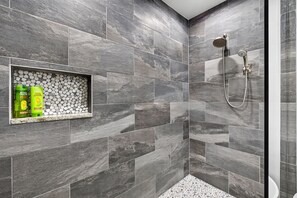 Shower, hair dryer, towels, shampoo