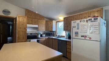 Cottage, 4 Bedrooms | Private kitchen | Fridge, coffee/tea maker