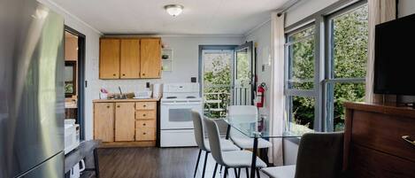 Fridge, microwave, stovetop, cookware/dishes/utensils