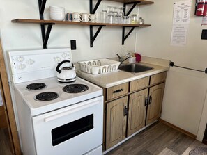 Fridge, microwave, stovetop, cookware/dishes/utensils