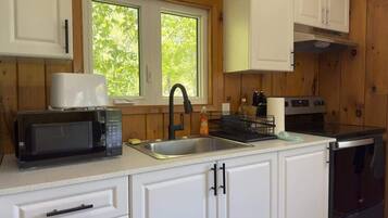 Fridge, microwave, stovetop, cookware/dishes/utensils