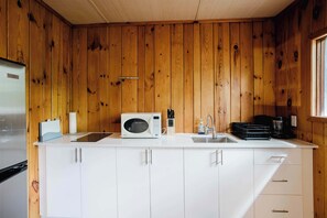 Fridge, microwave, stovetop, cookware/dishes/utensils