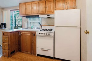 Fridge, microwave, stovetop, cookware/dishes/utensils