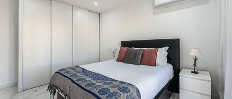 1 bedroom, desk, iron/ironing board, travel crib