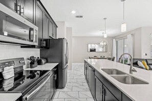 Fridge, microwave, oven, stovetop - Family Home at Storey Lake w/ Pool (kissimmee)