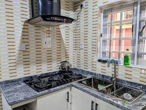 Deluxe Apartment, Balcony, City View | Private kitchen | Fridge, microwave, oven, stovetop