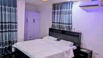 Deluxe Apartment, Balcony, City View | Desk, laptop workspace, blackout drapes, soundproofing