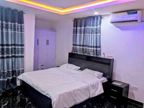 Deluxe Apartment, Balcony, City View | Desk, laptop workspace, blackout drapes, soundproofing